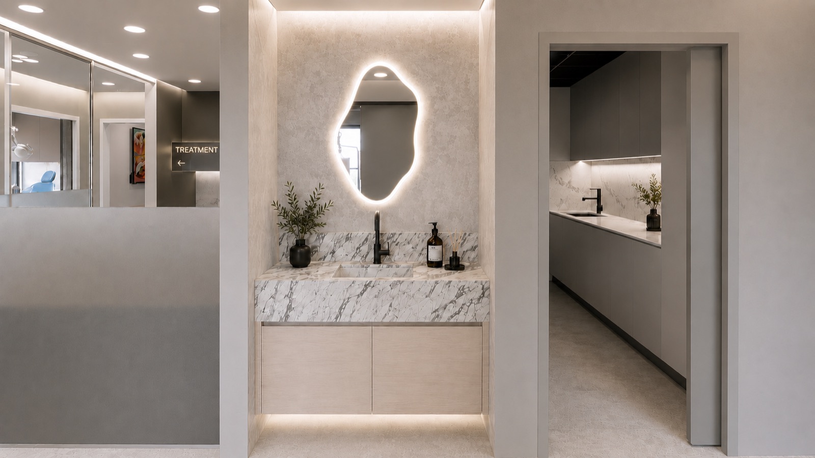 Spa-style vanity with backlit mirror and marble